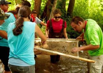 Honeywell Summer Science Week Participants Work Together to Collect Field Samples from Onondaga Creek.