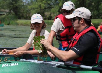 Moses Discusses the Importance of Removing Invasive Water Chestnut Plants from Onondaga Lake.