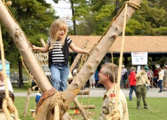 Heavenly Woods Balances Her Way Across the Boy Scout's Rope Course.