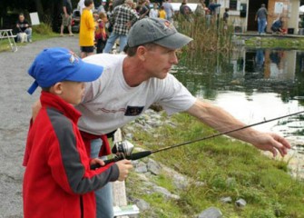 A Fisherman-in-Training Gets a Lesson from His Dad.