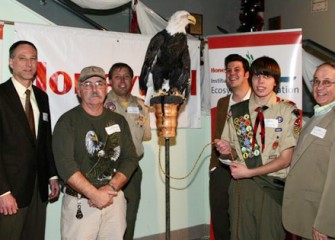 Eagle Scout Candidate Will Hirsh and his Dad Pose with Audubon and Honeywell Representatives and Liberty the Bald Eagle