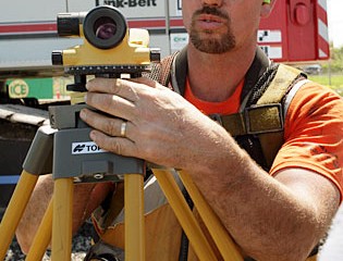 Workers Monitor Installation Process