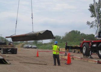 The first steel arrives to the shoreline to begin Phase III of the Barrier Wall.