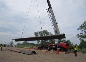 Steel panels are stacked on site before use.