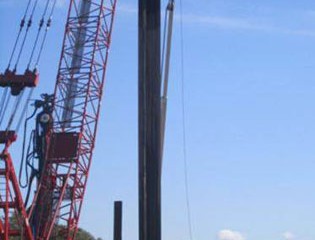 Steel is hoisted into place.