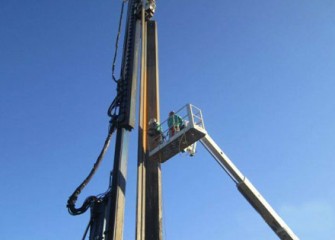 Workers continue installing Phase III of the barrier wall.