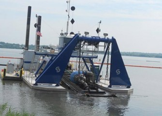 A hydraulic dredge operates in Onondaga Lake. Over the next four years three hydraulic dredges will remove about 2 million cubic yards of material from the lake bottom.