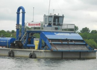 A hydraulic capping barge on Onondaga Lake before operations begin.