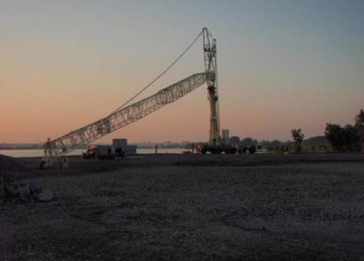 A 600-ton crane on western shoreline to assist with debris removal