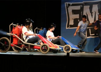 Middle school students race to the finish line in go-carts, learning about Newton's Third Law of Motion.