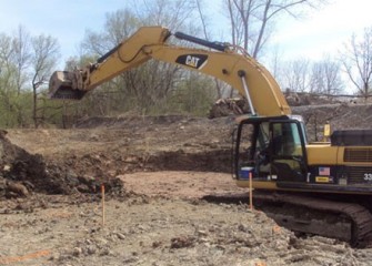 Excavators begin shaping the new Geddes Brook channel