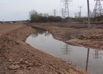 Geddes Brook is temporarily rerouted allowing workers to restore the wetlands in dry conditions