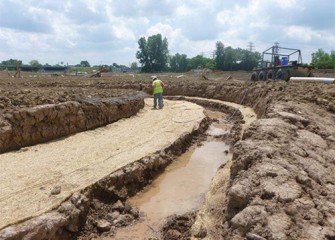 Biodegradable textile mats installed along the new stream channel