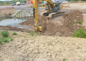 Water begins to flow into the new Geddes Brook channel