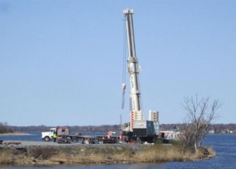 A 600-ton crane will aid in assembly of dredging equipment.