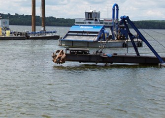 A cutter head will break up the lake bottom before it is suctioned into the pipeline.