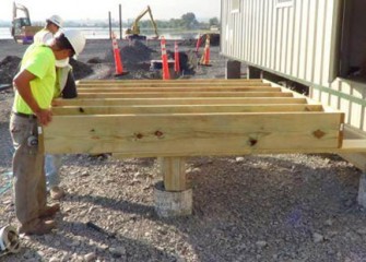 Stairs and an entry deck to the offices are built