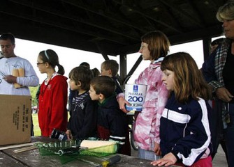 Town of Camillus Parks and Recreation Director Eric Bacon Hands Out Painting Supplies