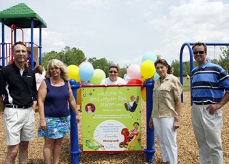 Camillus Resident and Local Mom Leslie Petty (center) Initiated Work on the Community Playground