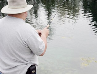 A sportsman casts a line