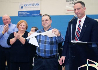 Solvay Tigers Athletic Club President Joseph Alcaro Shreds a Copy of the Pool Repair Loan