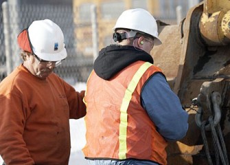 Workers Inspect Machinery