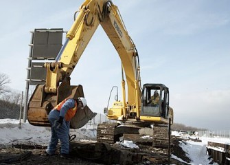 Technician Inspects Vibratory Hammer