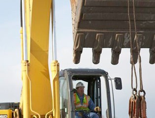 Worker Operates Machinery