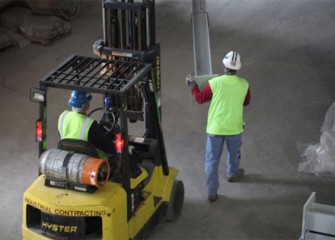 Workers installing a trestle to support pipes