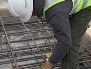 Iron worker installing floor reinforcement