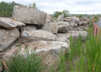 Boulders excavated along Nine Mile Creek are stockpiled for later use.