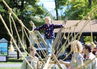 Boy Scouts from Troop 152 in Fayetteville, New York, guide Reese Hansen, of Jamesville, New York.