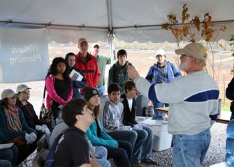 Volunteers learn about wetlands from Joseph McMullen, principal environmental scientist at Terrestrial Environmental Specialists, Inc.