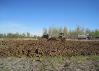 Clay is Delivered to the Consolidation Area to Begin Construction of the Impermeable Clay Liner