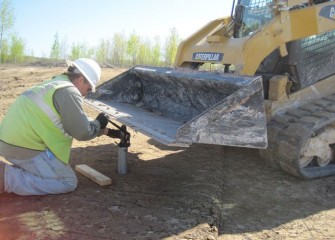 A Quality Control Technician Samples Clay for Laboratory Analyses