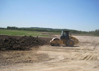 The Clay is Mechanically Compacted with a Vibratory Roller