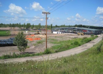 Construction of the containment Area (background) and water treatment plant continue throughout 2011.