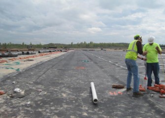 Quality Assurance Engineers Monitor Settlement Within the Containment Area