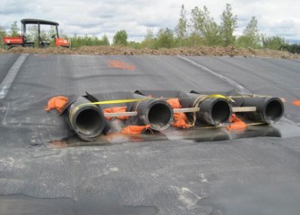 Pipes are installed to transport water from the containment area to the water treatment plant.