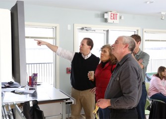 Before the program begins, participants view a video on the Onondaga Lake cleanup process.