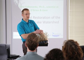 Tony Eallonardo , Ph.D., project scientist at O’Brien & Gere, talks about native trees, shrubs and grasses planted at sites after contamination has been removed.