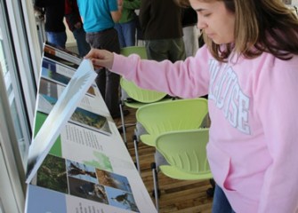 Onondaga Lake Conservation Corps volunteers continue to learn from the exhibits at the Onondaga Lake Visitors Center after the program.