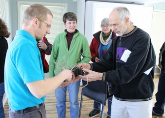 Before departing, Onondaga Lake Conservation Corps environmental stewards are given prairie cordgrass, a native plant that formerly grew in the inland salt marshes adjacent to Onondaga Lake.