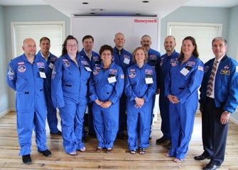 Central New York Honeywell Educators @ Space Academy, from left to right: (front row) David Chizzonite, Mary Newman, Linda Trippany, Carol Glor, Pamela Herrington, and former NASA astronaut Donald Thomas, (back row) Scott Daley, Robert Woolery, David Amidon, Brian Ramsden and Scott Macomber. Not pictured: Gary Brisson.