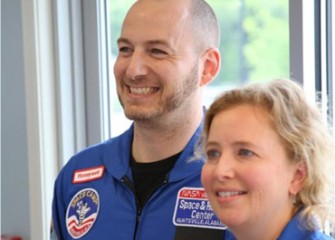 Scott Macomber, a Camillus Middle School Math Teacher, and Carol Glor, a Home and Careers Teacher at West Genesee Middle School and Camillus Middle, in their new flight suits.