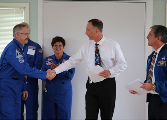 Brian Ramsden, Math Teacher at Camillus Middle School, is congratulated as Linda Trippany, Science Teacher at Lincoln Middle School (Syracuse), looks on.