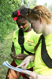 Manlius Pebble Hill School student Amina Kilpatrick (left) and Eagle Hill Middle School student Sophia Hall (right) study leaves to identify trees.