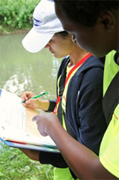 H.W. Smith Middle School student Melissa Marin Aquilera (left) and Danforth K-8 School student Devaner Surrey (right) record their findings and observations.