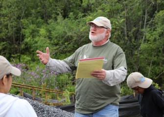 At Harbor Brook, wetland expert Joe McMullen, provides volunteers with an overview of the planting activities.