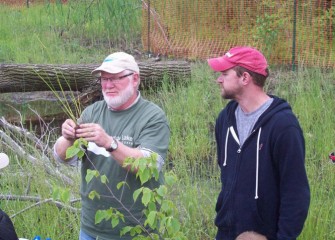 Joe McMullen shows the correct way to prepare a grass plug for planting.